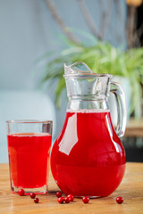 Fresh juice in a glass on a wooden table. The concept of healthy eating