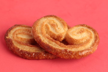 Puff pastry cookies on colorful background
