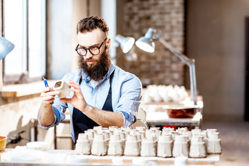 Man working with ceramics at the pottery