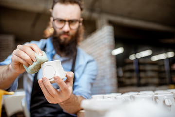 Man working with ceramics at the pottery