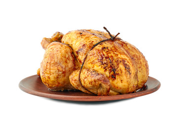 Roasted crispy chicken on ceramic dish over white background