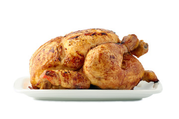 Roasted crispy chicken on dish over white background