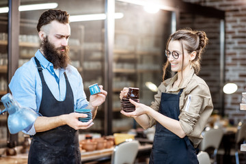 Man and woman with ceramics at the pottery