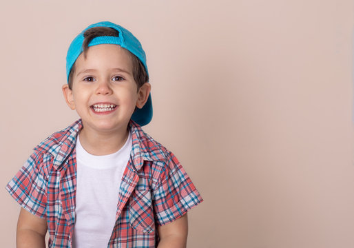 Smiling Young Boy Wearing Baseball Cap. Summer, Isolated 