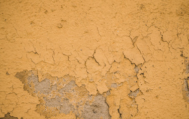 background of wall with peeled paint yellow