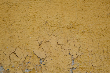 background of wall with peeled paint yellow
