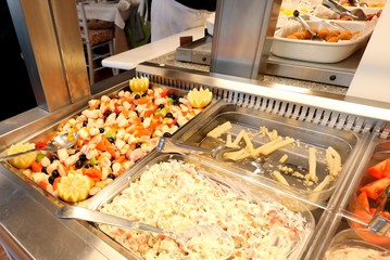 self service restaurant with many raw and cooked foods