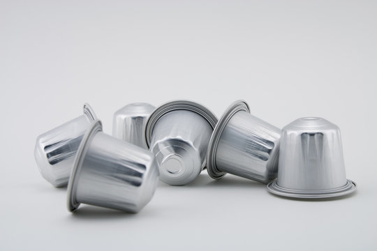 Espresso coffee capsules or coffee pods on white background. Coffee machine.