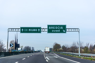Highway road sign to Milano and Brescia, Italy