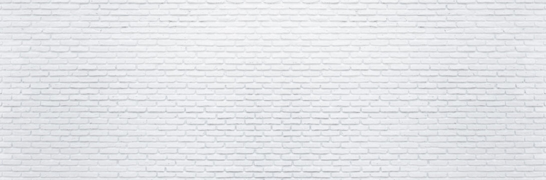 Fototapeta Abstract white brick wall texture background. Horizontal panoramic view of masonry brick wall.