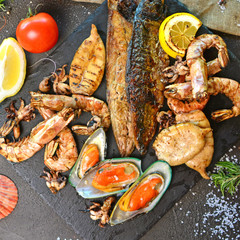 Grilled mediterranean set with fish, shrimp, squid, mussels. Story of my table.