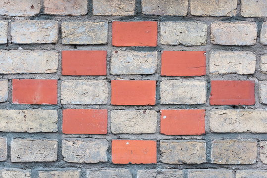 Fototapeta red and grey bricks building a wall with a special pattern