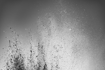 Monochrome background with water bursts