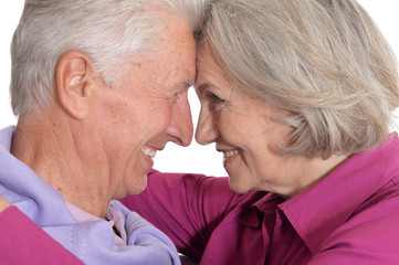 Close up portrait of happy senior couple on white background