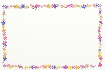 Frame with colorful daisy heads on the white background