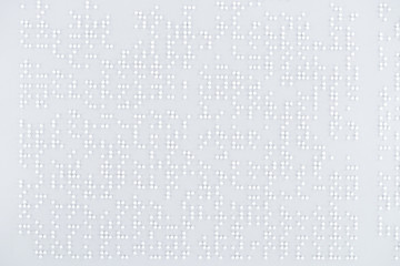 top view of text in international braille code on white paper - obrazy, fototapety, plakaty