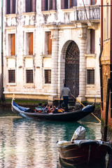 Fototapeta na wymiar Beautiful view of traditional Gondolas on famous Venice canals