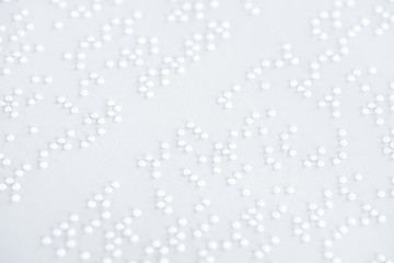 background of text in international braille code on white paper - obrazy, fototapety, plakaty