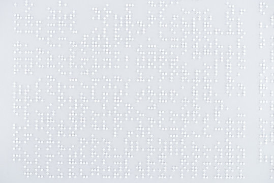 top view of text in international braille code on white paper