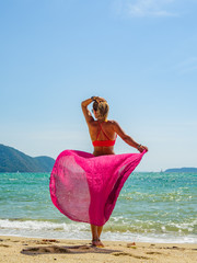 Woman enjoying her holidays at the tropical beach