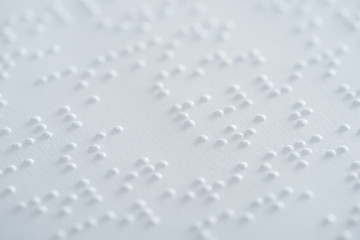 close up view of text in braille code on white paper - obrazy, fototapety, plakaty