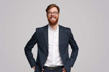 Confident ginger businessman smiling for camera