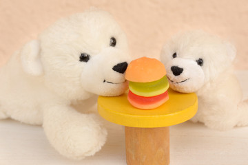 Teddy bear family smelling hamburger