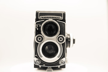 Vintage camera with lens isolated on white background. Antique technology of old times devices. Old-fashioned photography