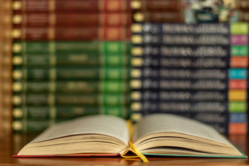 Education learning concept with opening book or textbook in old library