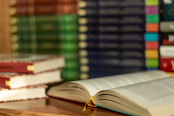 Education learning concept with opening book or textbook in old library