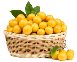 Cherry plums in basket isolated on white
