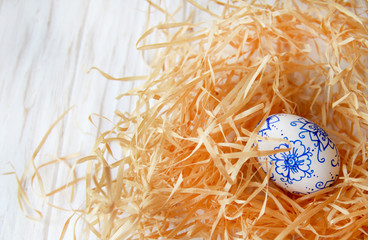 Decor for Easter, the egg in blue and white colors, creativity with children