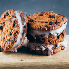 Chocolate Ice cream sandwiches and chocolate chip cookies on wooden board