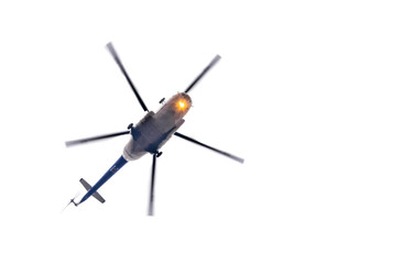 Helicopter in flight with big propeller blades isolated on white background. Large aircraft...