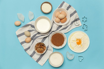Creating a recipe, Top view of the basic baking ingredients on the blue table, cooking concept