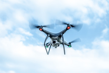Modern beautiful dark drone in the sky.