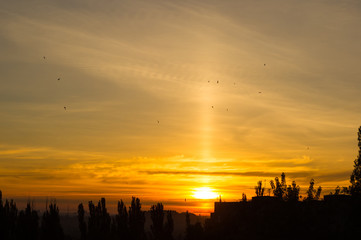 Fototapeta premium Landscape with dramatic light - beautiful golden sunset with saturated sky and clouds.