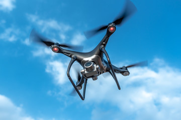 Modern beautiful dark drone in the sky.