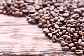 Coffee beans on brown wooden table