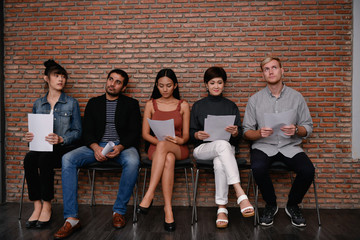 Fototapeta premium Business concept. Businessman waiting for job interview. Business people are serious about reading the exam.