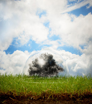 Explosion under glass against cloudy sky