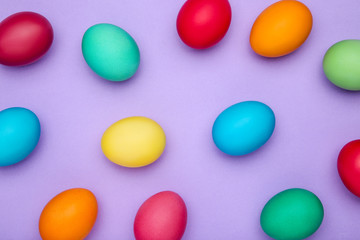 Colorful easter eggs on purple background
