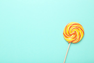 Colorful lollipop on mint background