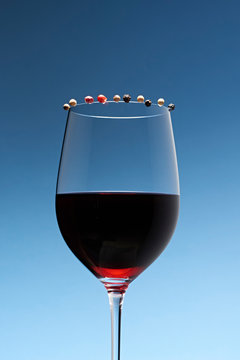 Wine in glass against blue background