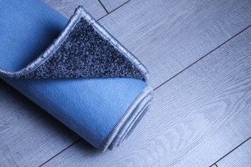 Gray carpet with stitched edges