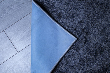 Gray carpet with stitched edges