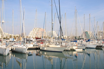 Pyramids buildings and pleasure boats in the seaside resort and marina  of la Grande Motte in Herault department, France
