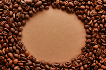 Scattered coffee beans frame design on copy space background.