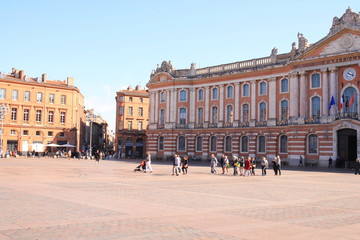 Obraz premium Toulouse central square and the emblematic and majestic Capitole, a town hall and theatre in the heart of the pink city, the major city of Southwestern France and historical capital of Languedoc