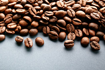 Scattered coffee beans frame design on copy space background.